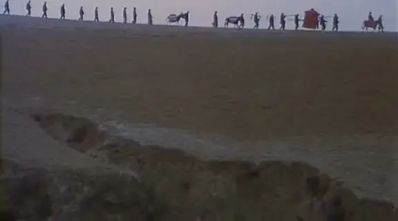 A line of figures crossing the loess ridge in Yellow Earth (1984)